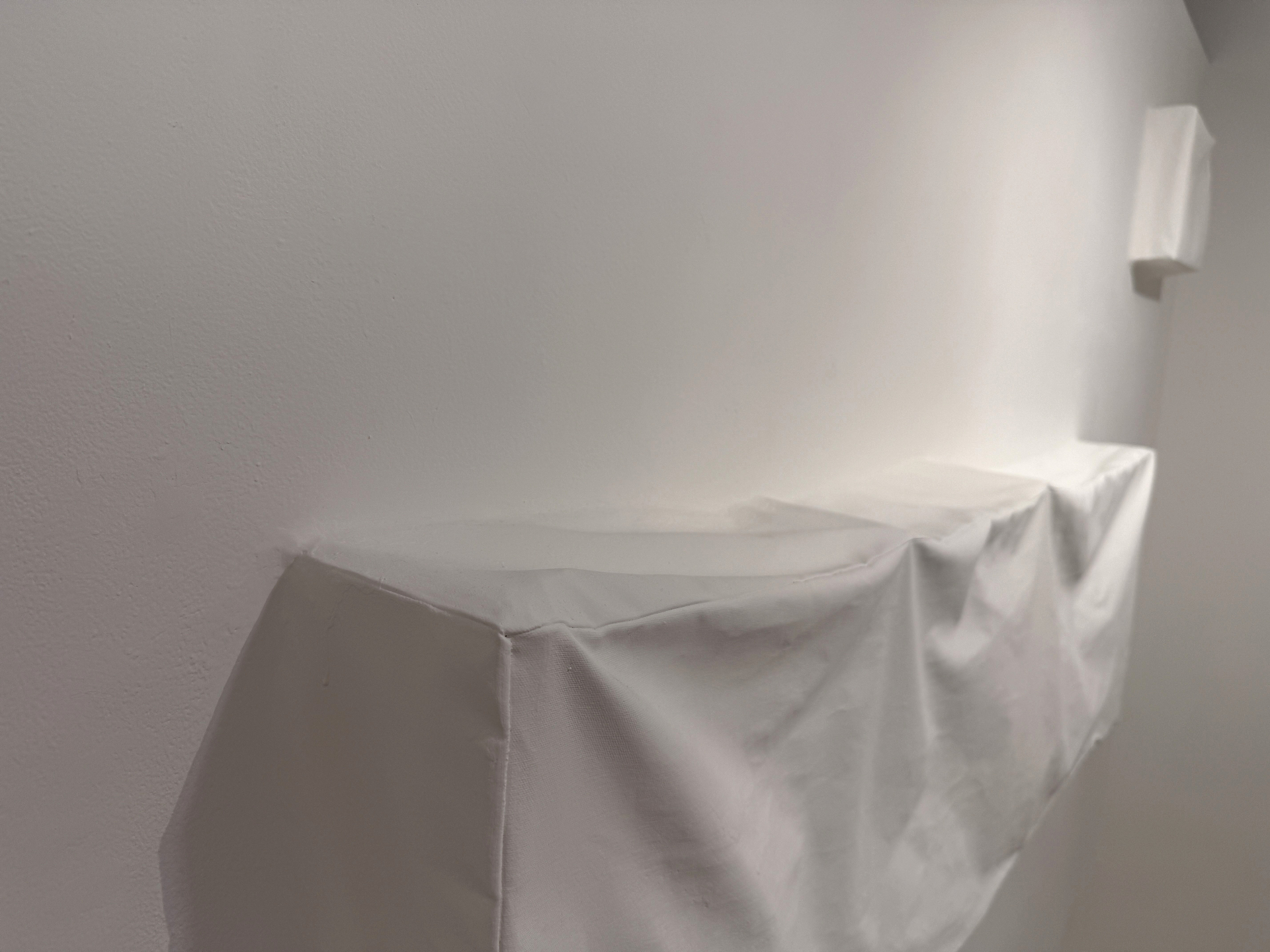 Soojeong Park, Living Surfaces, 2026, Installation, sewn canvas, nails, L-shaped stand, gesso, wall putty, wall paint, bass shakers, exciters, amplifiers, MP3 player, electrical wires (view 3 of 8)