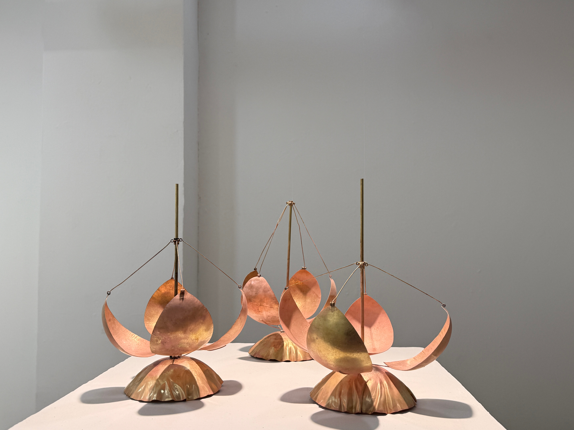 Soojeong Park, Working Buds, 2026, Kinetic installation, Brass, motors, pulleys, bearings, wood, iron, and fishing line (view 2 of 2)